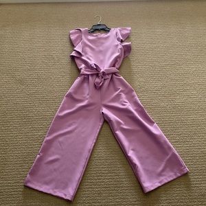 This lavender jumpsuit is so cute and has only been worn once.